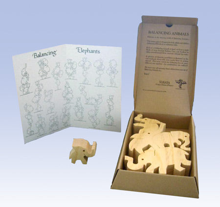 TARATA Balancing Elephants - Natural (G) Hand made from farm forested timber, these fun puzzles will challenge your skills, dexterity and patience as you try and balance them.  It's simply a matter of holding your tongue in the right place! Each set comes attractively gift boxed,  with full instructions and a challenging configuration card showing about 20 of the literally 100's of possible ways of balancing each set, and for even more fun sets can be combined so you can make towers reaching the sky! 